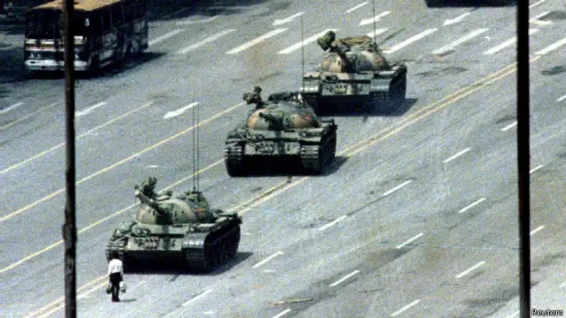 Photo of the day: A man in front of a tank